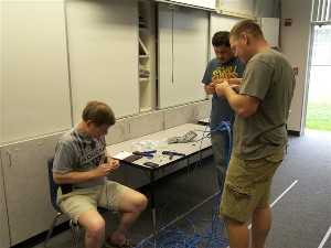 Chapter volunteers set up a new computer lab at Cook Elementary School in August as part of the Technology Needed in Schools program